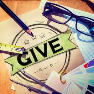 the word give written on a ribbon